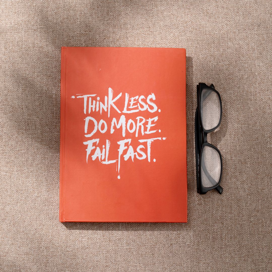 Weekly planner book open on a table with decorative items