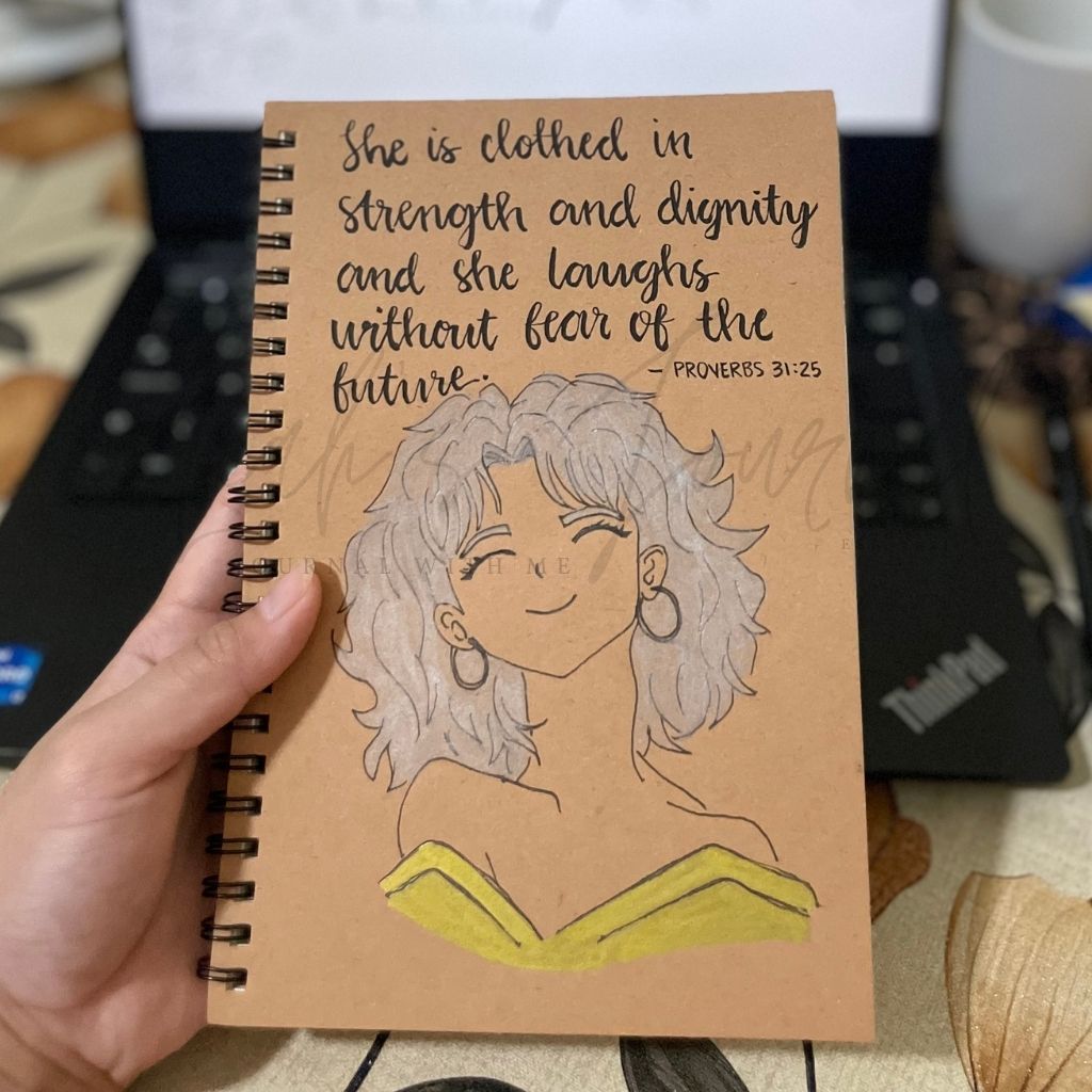 She is Clothed in Strength – A5 Kraft Notebook with Hand‑Drawn Scripture Calligraphy (Women’s Journal)