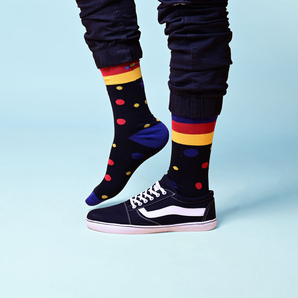 Weekly planner on a wooden table with plants in the background
