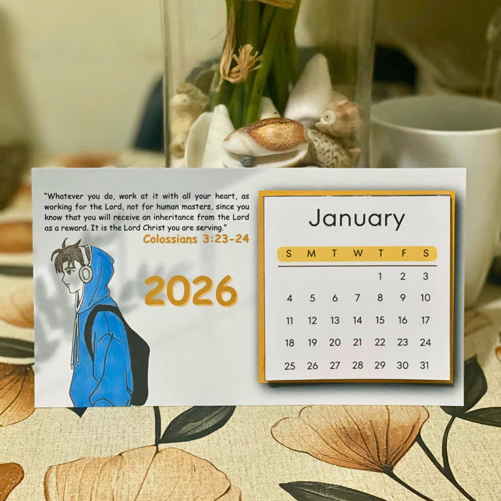 Calendar for January 2026 with a motivational quote and illustration on a decorative table.